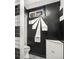 Basement bathroom with black walls and white fixtures at 7887 Quivas Way, Denver, CO 80221