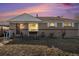 Ranch style home with a well-maintained lawn and charming front porch at 7887 Quivas Way, Denver, CO 80221