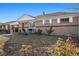 Brick ranch home with a well-maintained front yard at 7887 Quivas Way, Denver, CO 80221