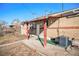 Backyard patio area with brick walls and AC unit at 7887 Quivas Way, Denver, CO 80221