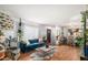 Spacious living area with hardwood floors and plenty of natural light at 7887 Quivas Way, Denver, CO 80221