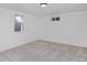 Finished basement room with neutral walls, carpet, and a window for natural light at 1924 S Huron St, Denver, CO 80223