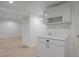 Finished basement with a small kitchenette and closet at 1924 S Huron St, Denver, CO 80223