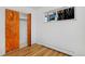 Bedroom with hardwood floors, closet, and a window at 1924 S Huron St, Denver, CO 80223