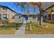 Cute bungalow home with a blue front door and nicely landscaped front yard at 1924 S Huron St, Denver, CO 80223