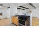 Kitchen with light wood cabinets and stainless steel appliances at 1924 S Huron St, Denver, CO 80223