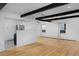 Living room showcasing hardwood floors and exposed beams at 1924 S Huron St, Denver, CO 80223