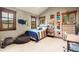 Bright bedroom with a comfy bed, built-in shelves, and large windows at 168 Corkscrew Dr, Breckenridge, CO 80424