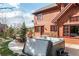 Relaxing hot tub on patio with fire pit and seating area at 168 Corkscrew Dr, Breckenridge, CO 80424