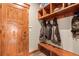 Convenient mudroom with bench, cubbies, and coat hooks at 168 Corkscrew Dr, Breckenridge, CO 80424
