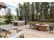 Outdoor patio with fire pit, seating, and picnic table at 168 Corkscrew Dr, Breckenridge, CO 80424