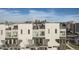 Exterior view of modern townhomes with city skyline in background at 1905 Hooker St, Denver, CO 80204