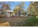 House backyard view with deck and sunroom at 9641 Sierra Dr, Arvada, CO 80005
