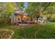 Backyard patio area with string lights and landscaping at 9641 Sierra Dr, Arvada, CO 80005