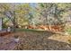 Spacious backyard with mature trees and a large grassy area at 9641 Sierra Dr, Arvada, CO 80005