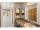 Clean bathroom with updated vanity and tile flooring at 9641 Sierra Dr, Arvada, CO 80005