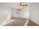 Spacious bedroom with large window and ceiling fan at 9641 Sierra Dr, Arvada, CO 80005