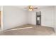 Upstairs bedroom with ceiling fan and neutral carpeting at 9641 Sierra Dr, Arvada, CO 80005