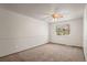 Bright bedroom with neutral carpeting and a ceiling fan at 9641 Sierra Dr, Arvada, CO 80005