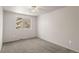 Bright bedroom featuring carpet flooring and a large window at 9641 Sierra Dr, Arvada, CO 80005