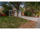 Brick front two-story house with attached two-car garage and mature landscaping at 9641 Sierra Dr, Arvada, CO 80005