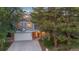 Two-story home with a gray exterior, attached garage, and basketball hoop at 9641 Sierra Dr, Arvada, CO 80005