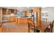 Kitchen boasts an island, wood cabinets, and granite counters at 9641 Sierra Dr, Arvada, CO 80005