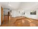 Bright living room with hardwood floors, chandelier, and large windows at 9641 Sierra Dr, Arvada, CO 80005