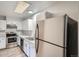 Kitchen with stainless steel appliances and white cabinets at 3923 E 121St Ave, Thornton, CO 80241