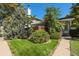 Inviting home exterior with landscaping and a walkway at 13 Nome Way # A, Aurora, CO 80012