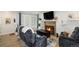 Living room with fireplace, comfortable seating, and hardwood floors at 13 Nome Way # A, Aurora, CO 80012