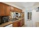 Bright kitchen with ample cabinetry, a pass-through to the living area, and modern appliances at 13 Nome Way # A, Aurora, CO 80012