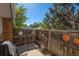 Small backyard with wooden fence, patio, and grill at 13 Nome Way # A, Aurora, CO 80012