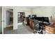 Home office with built-in desk, and a mirrored closet at 13 Nome Way # A, Aurora, CO 80012