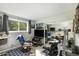 Home office/game room with TV, exercise equipment and guitar storage at 13 Nome Way # A, Aurora, CO 80012