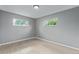 Spacious bedroom with gray walls and wood-look floors at 9400 Lilly Ct, Thornton, CO 80229