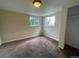 Simple bedroom with neutral colored walls and carpeted floors at 1522 Tamarac St, Denver, CO 80220