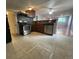 Modern kitchen featuring stainless steel appliances and tiled floors at 1522 Tamarac St, Denver, CO 80220
