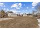 View of backyard, showing house and detached garage at 7511 Leyden St, Commerce City, CO 80022