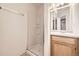 Small bathroom with shower stall and single vanity at 2067 S Bryant St, Denver, CO 80219