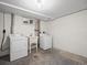 Basement laundry area with washer, dryer and sink at 6325 Martin Luther King Jr Blvd, Denver, CO 80207