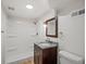 Basement bathroom with shower and granite vanity at 6325 Martin Luther King Jr Blvd, Denver, CO 80207