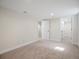 Finished basement with carpet, and doors to other rooms at 6325 Martin Luther King Jr Blvd, Denver, CO 80207