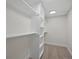 Finished basement with shelving and hanging rod at 6325 Martin Luther King Jr Blvd, Denver, CO 80207