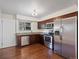 Modern kitchen with stainless steel appliances at 6325 Martin Luther King Jr Blvd, Denver, CO 80207