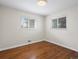 Bright bedroom with hardwood floors and large windows at 6325 Martin Luther King Jr Blvd, Denver, CO 80207