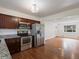 Open kitchen with stainless steel appliances and hardwood floors at 6325 Martin Luther King Jr Blvd, Denver, CO 80207