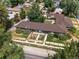 Aerial view of a multi-unit residential building with a well-maintained yard and surrounding neighborhood at 6325 Martin Luther King Jr Blvd, Denver, CO 80207