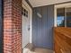 Front entrance with brick and gray siding at 6325 Martin Luther King Jr Blvd, Denver, CO 80207