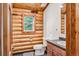 Simple bathroom with wood-paneled walls and a toilet at 274 Cr 672, Breckenridge, CO 80424